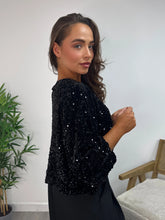 Load image into Gallery viewer, Black Sequin Bow Front Cropped Hem Top